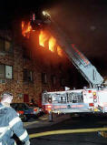 Firefighters try to control a fire at the Nathan